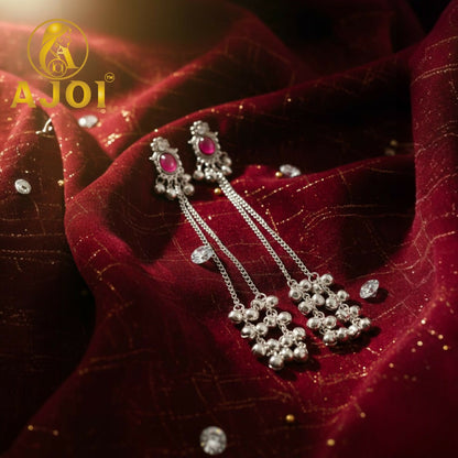 Pair of Kashmiri silver-tone ruby chain drop earrings on white background
