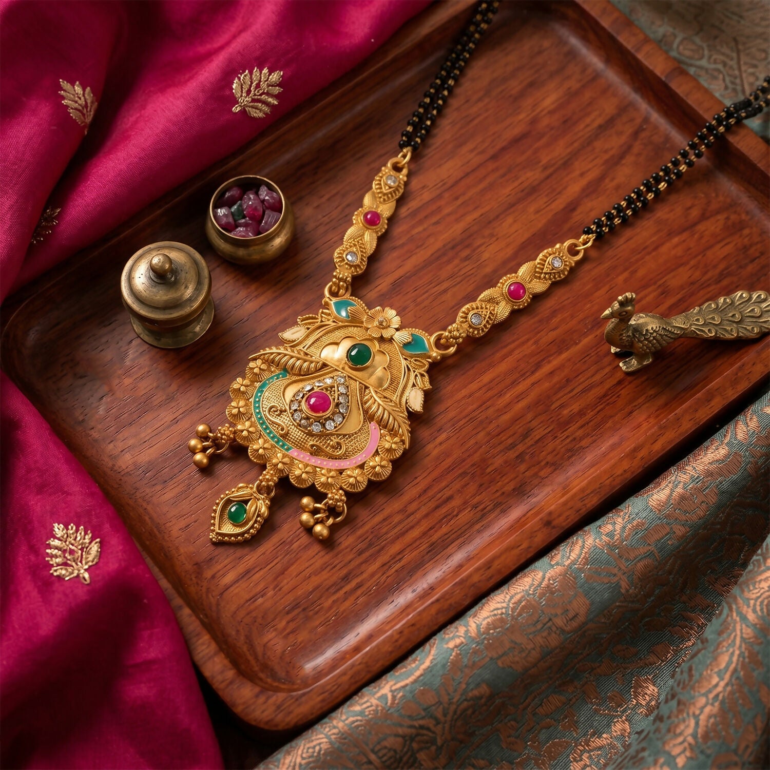 Side view of Kalash pot pendant with elaborate enamel work and vintage finish