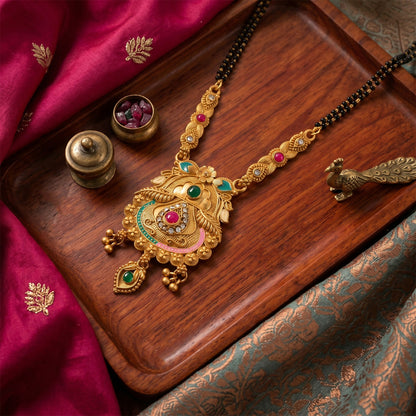 Side view of Kalash pot pendant with elaborate enamel work and vintage finish