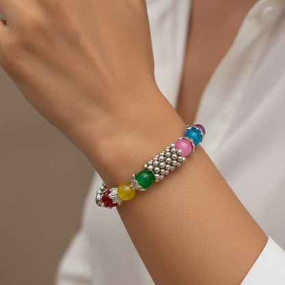 Multi beads bracelet with silver detailing on stretch band front view