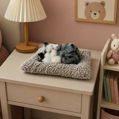 Close-up of sleeping cat plush toy fur texture