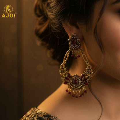 Side angle of vintage maroon floral chandbali earrings showing bead tassels