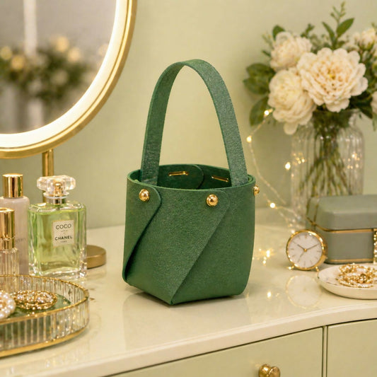 Green mini bucket handbag with studded handle front view