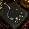 Oxidized Silver Peacock Bracelet with Kundan Stone & Red Bead Charms Adjustable Chain