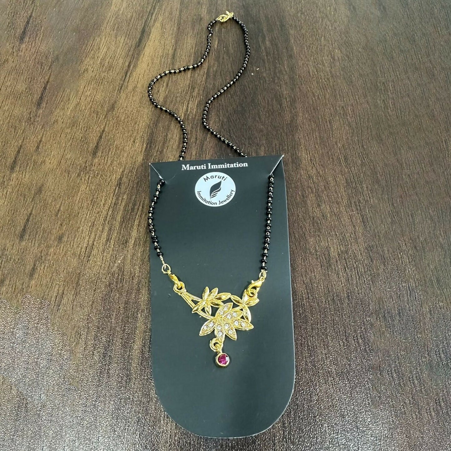 Elegant Gold-Toned Floral Mangalsutra with Stone-Studded Pendant for Women