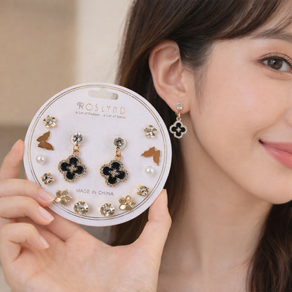 Elegant gold and black combo earrings set with floral and pearl designs