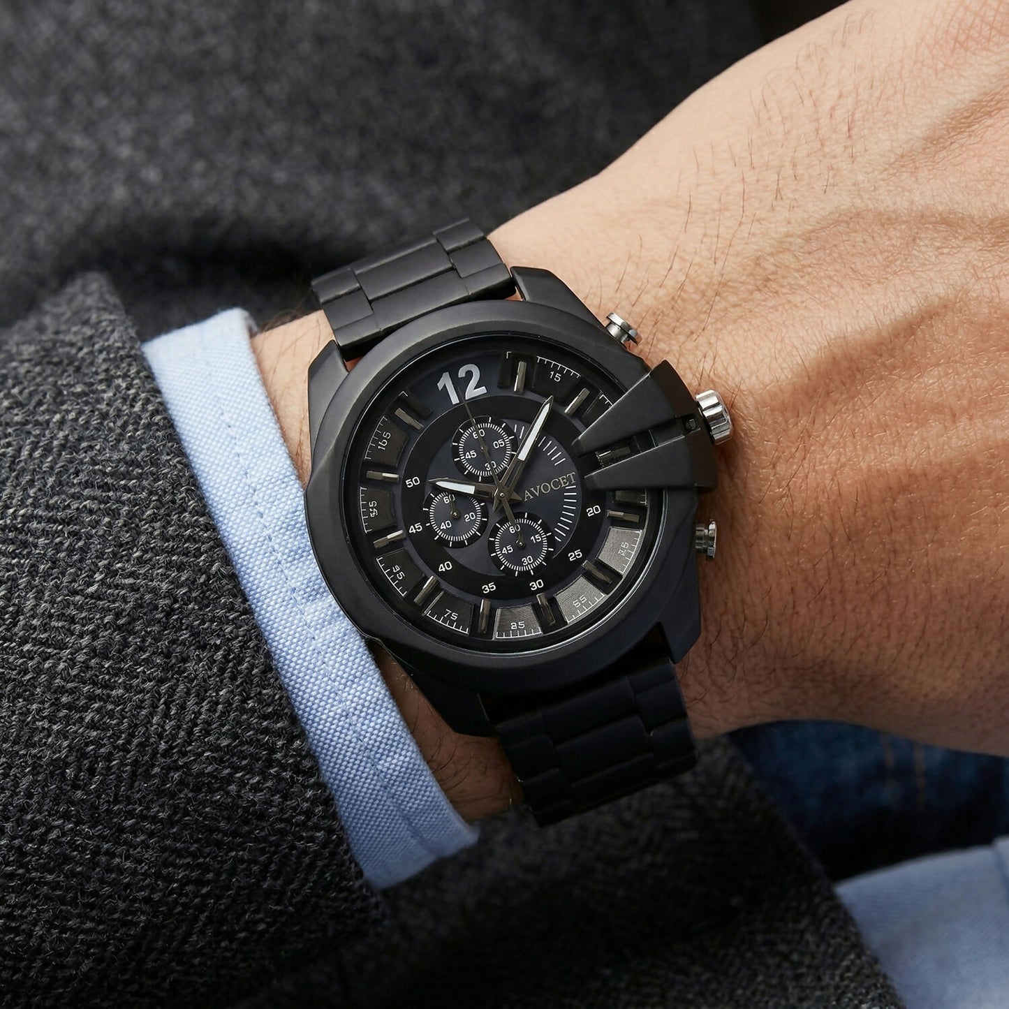 Black wrist watch showing detailed chronograph dial