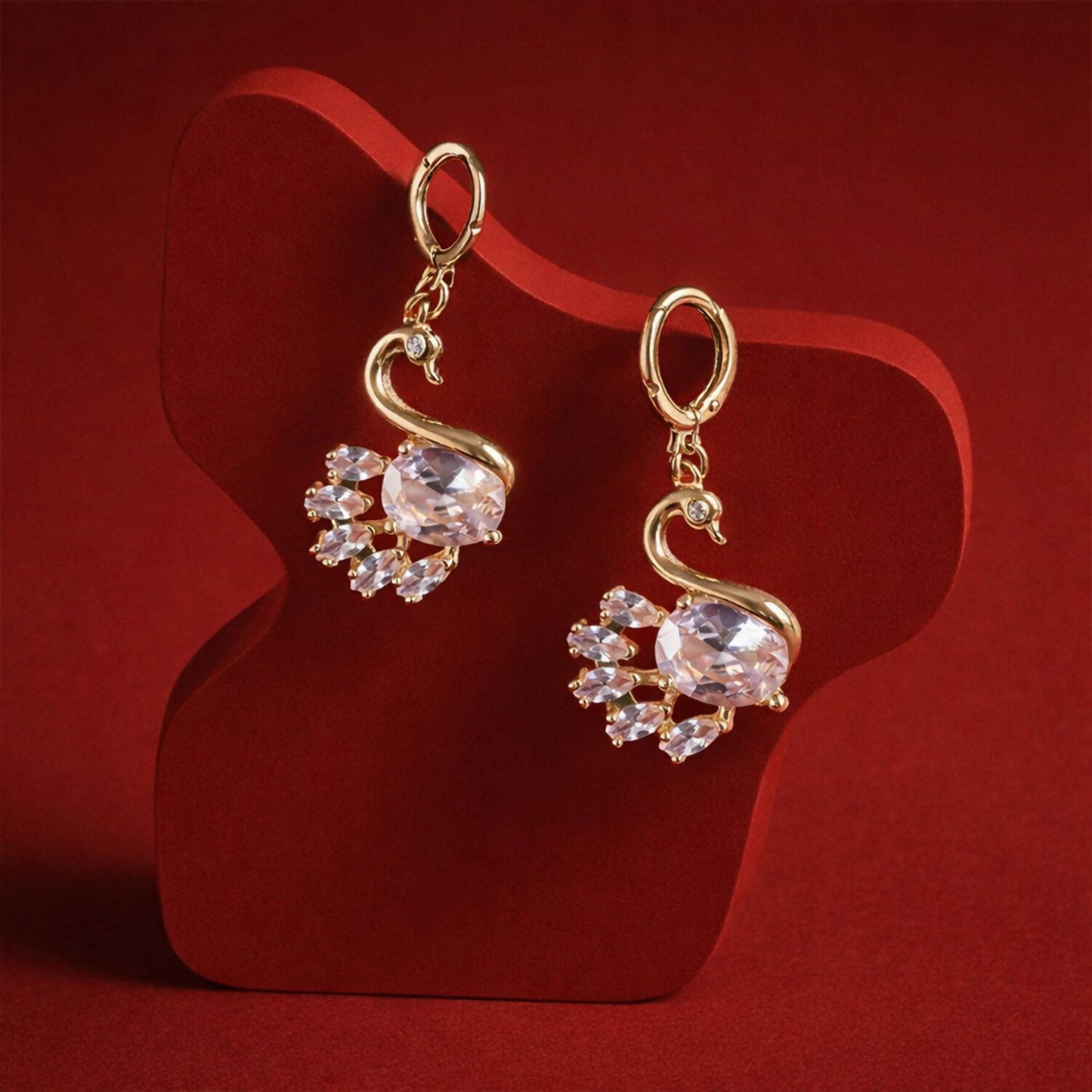 Swan design stone drop earrings showcasing elegant curved shape and clear stones