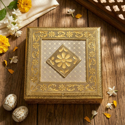 Floral embossed golden metal jewelry box side view showcasing design