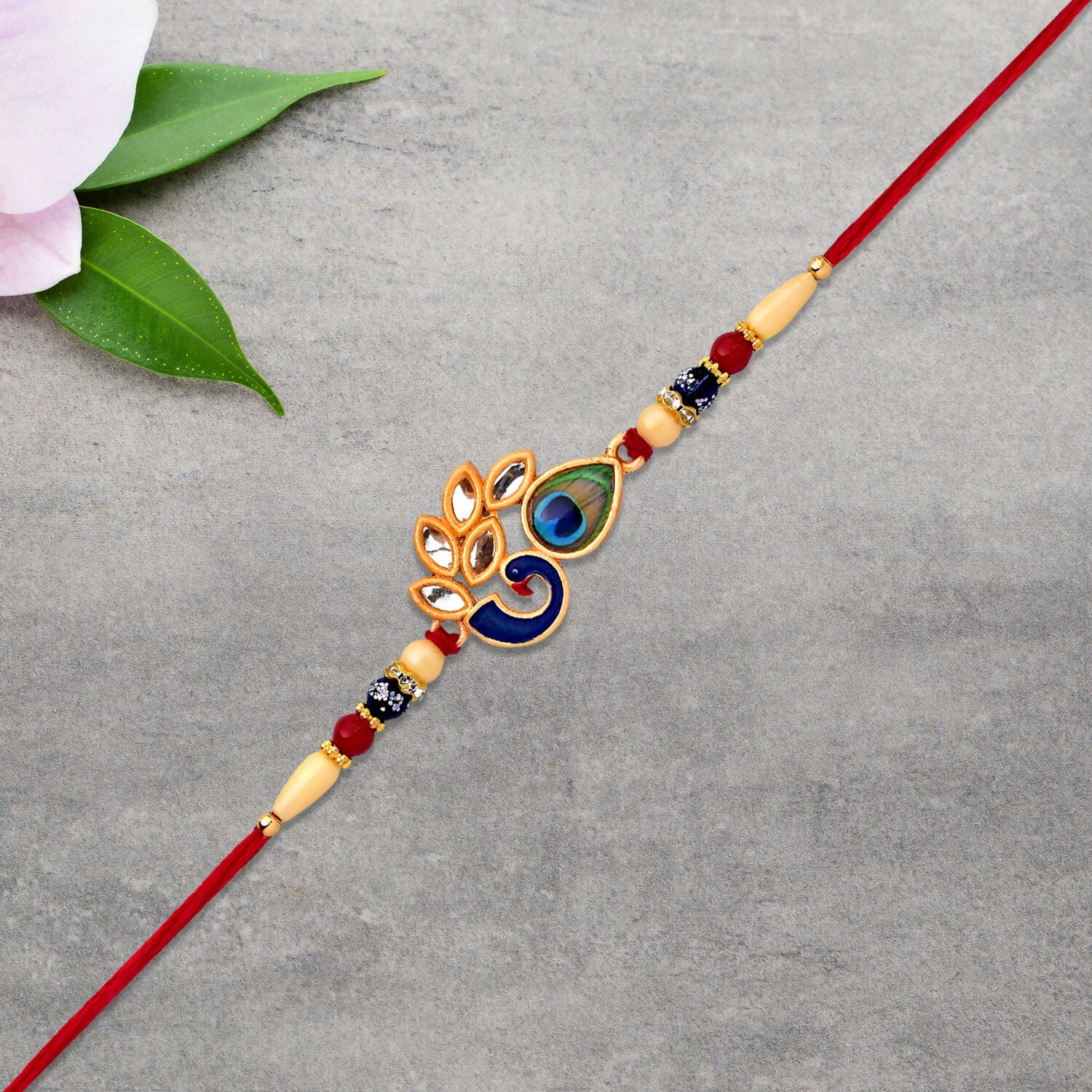 Mor Pankh Rakhi showcasing colorful enamel and threadwork