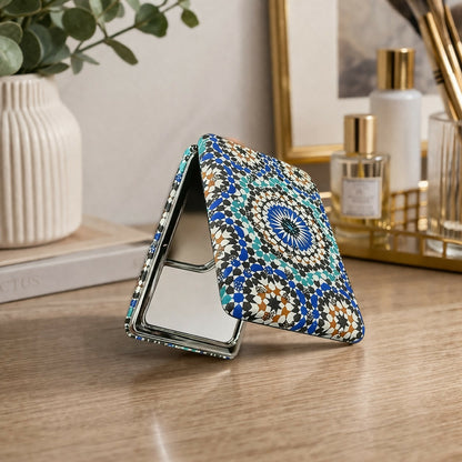 Compact foldable pocket mirror with elegant patterned design