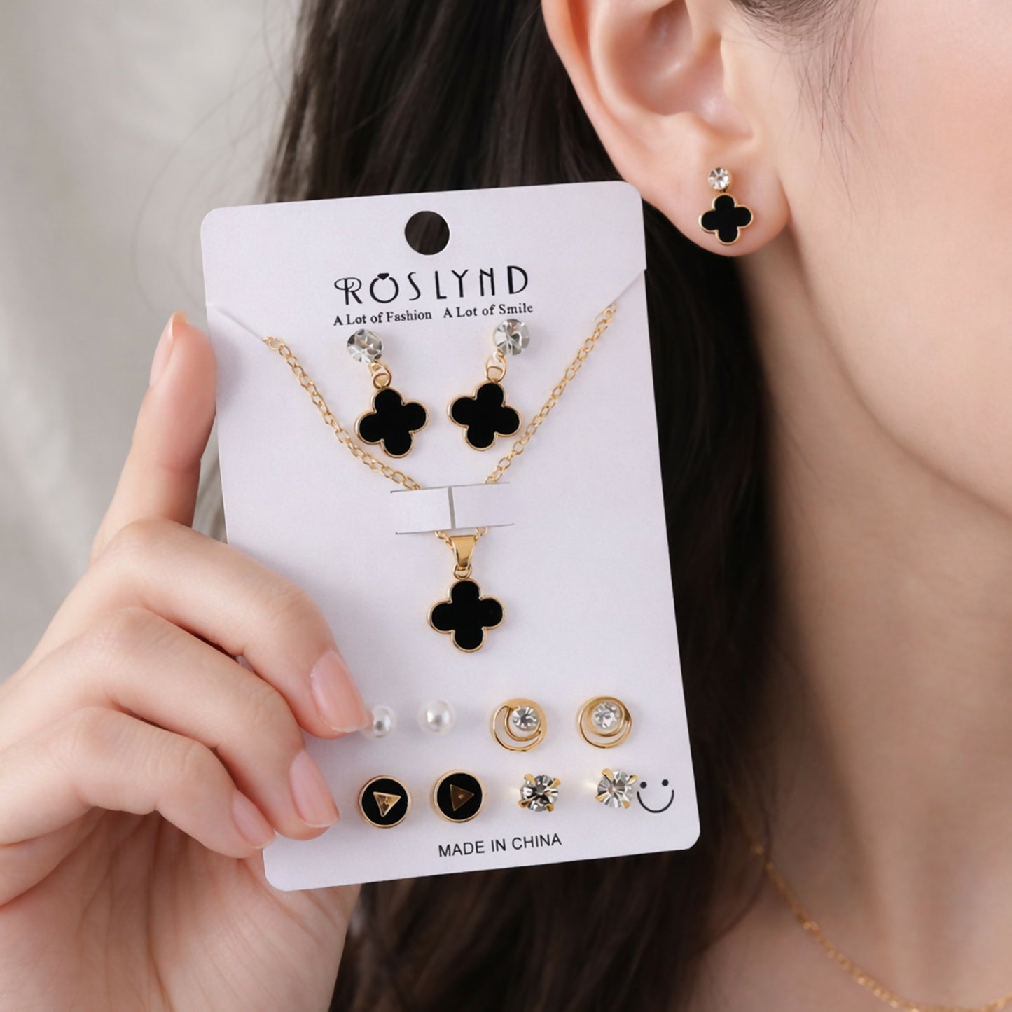 Gold plated black clover pendant necklace and stud earrings combo set for women