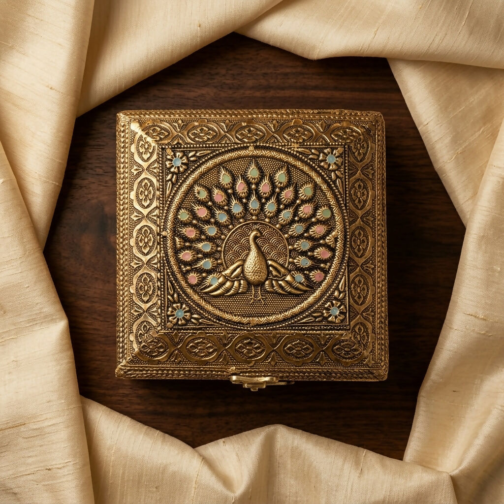 Side angle of brass plated peacock decorative storage box