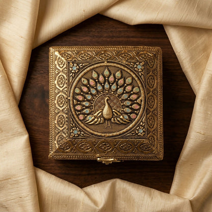 Side angle of brass plated peacock decorative storage box