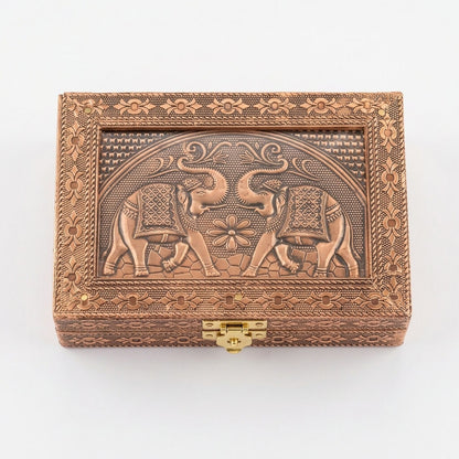 Top view of copper-finish metal jewelry box with elephant motif