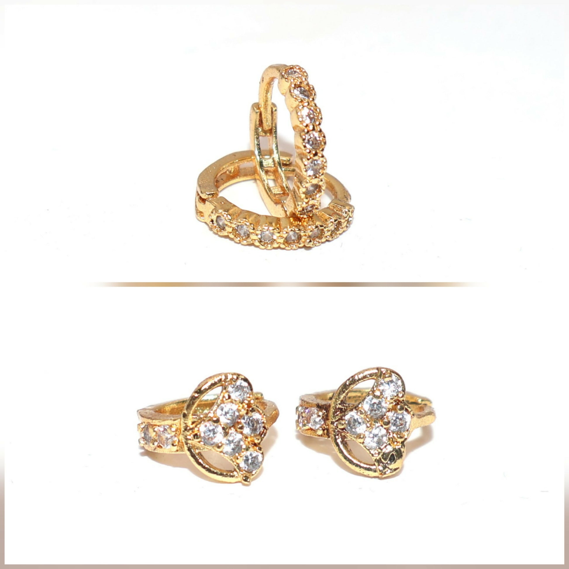 Pair of gold plated cubic zirconia two-row huggie hoop earrings displayed on black background