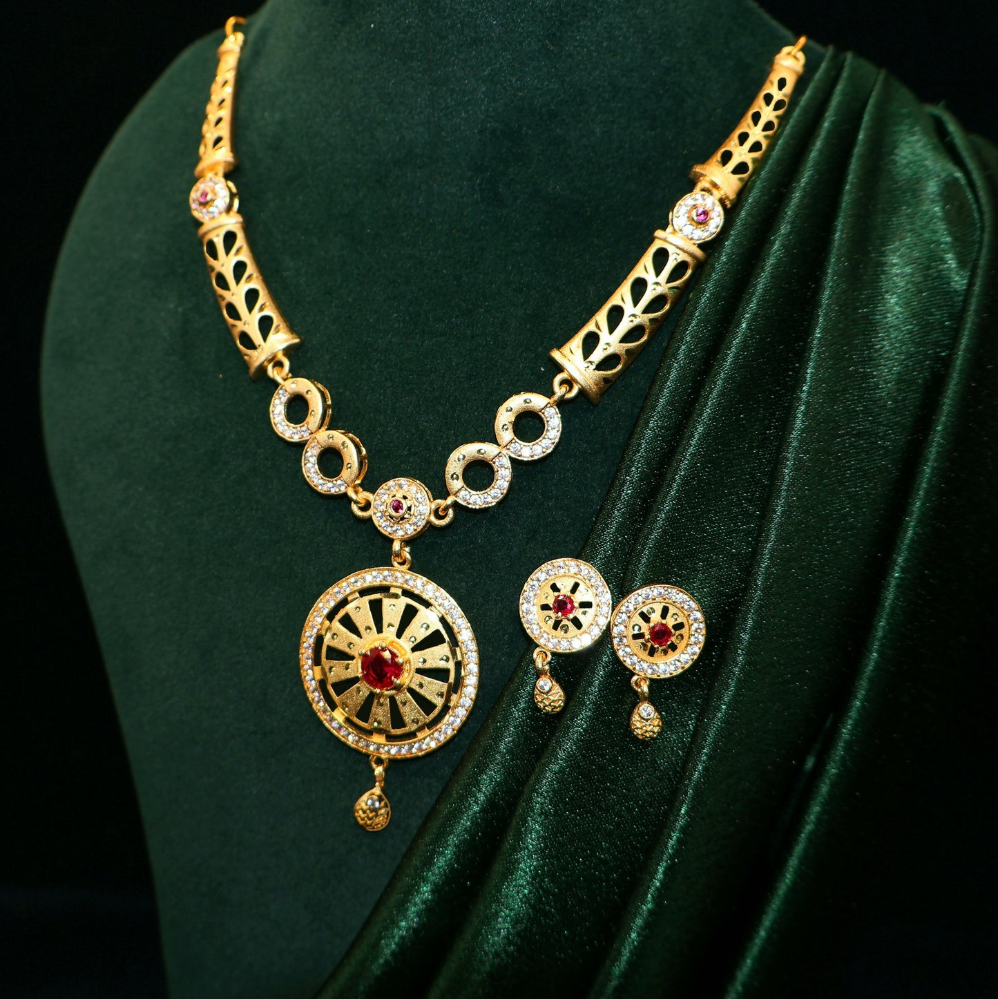 Gold Plated Round Pendant Forming Necklace Set with Ruby Stone & AD Detailing