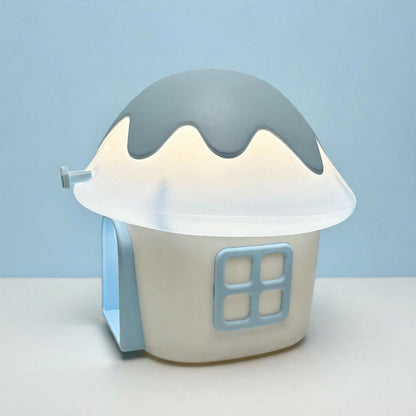 A light blue and white mushroom house night light with a small square window and an open door on a plain background.