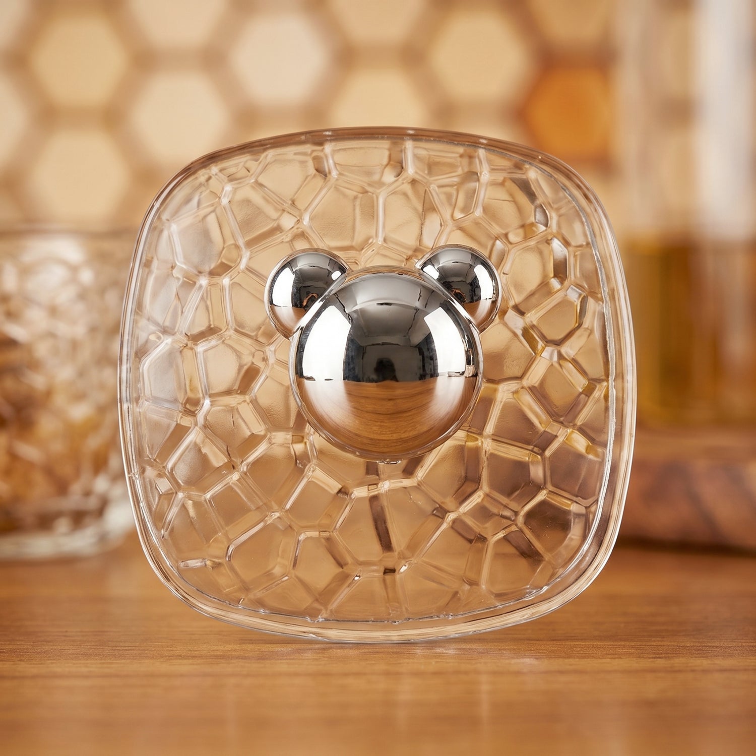 Set of 3 clear plastic adhesive wall hooks displayed on a surface