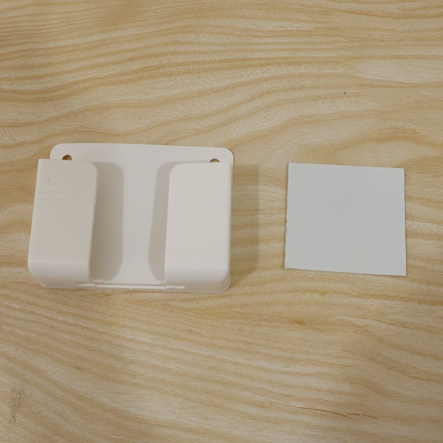 Live photo of self adhesive wall mounted phone holder