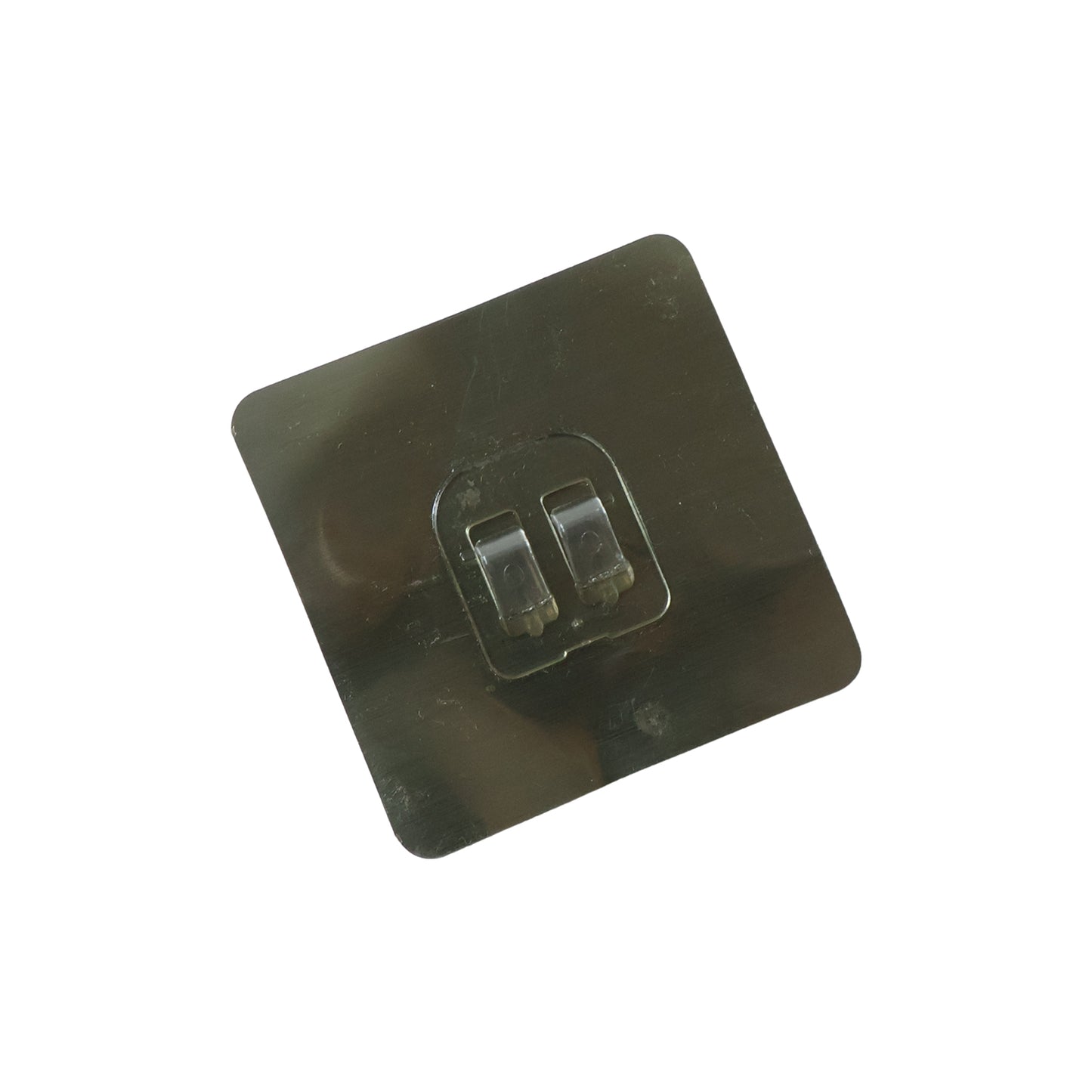 Transparent adhesive wall hook attached to a glass surface