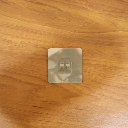 Transparent adhesive wall hook in real-life use