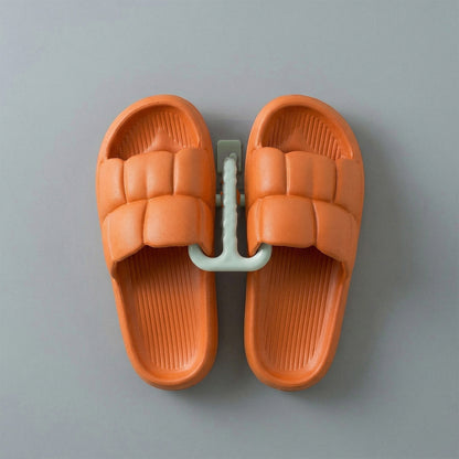 Wall mounted slipper holder in bathroom