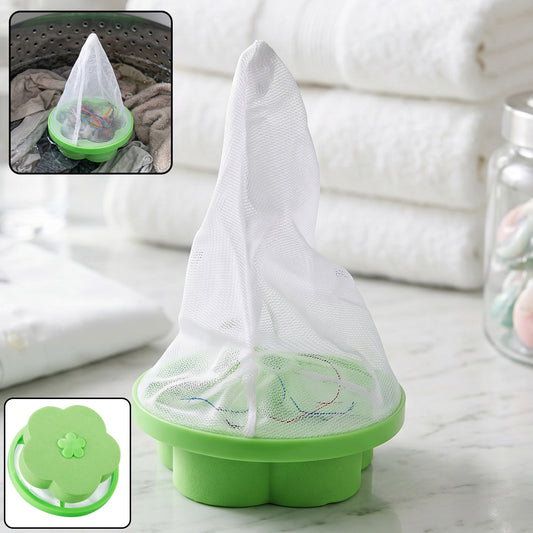Green flower-shaped floating lint catcher in washing machine drum