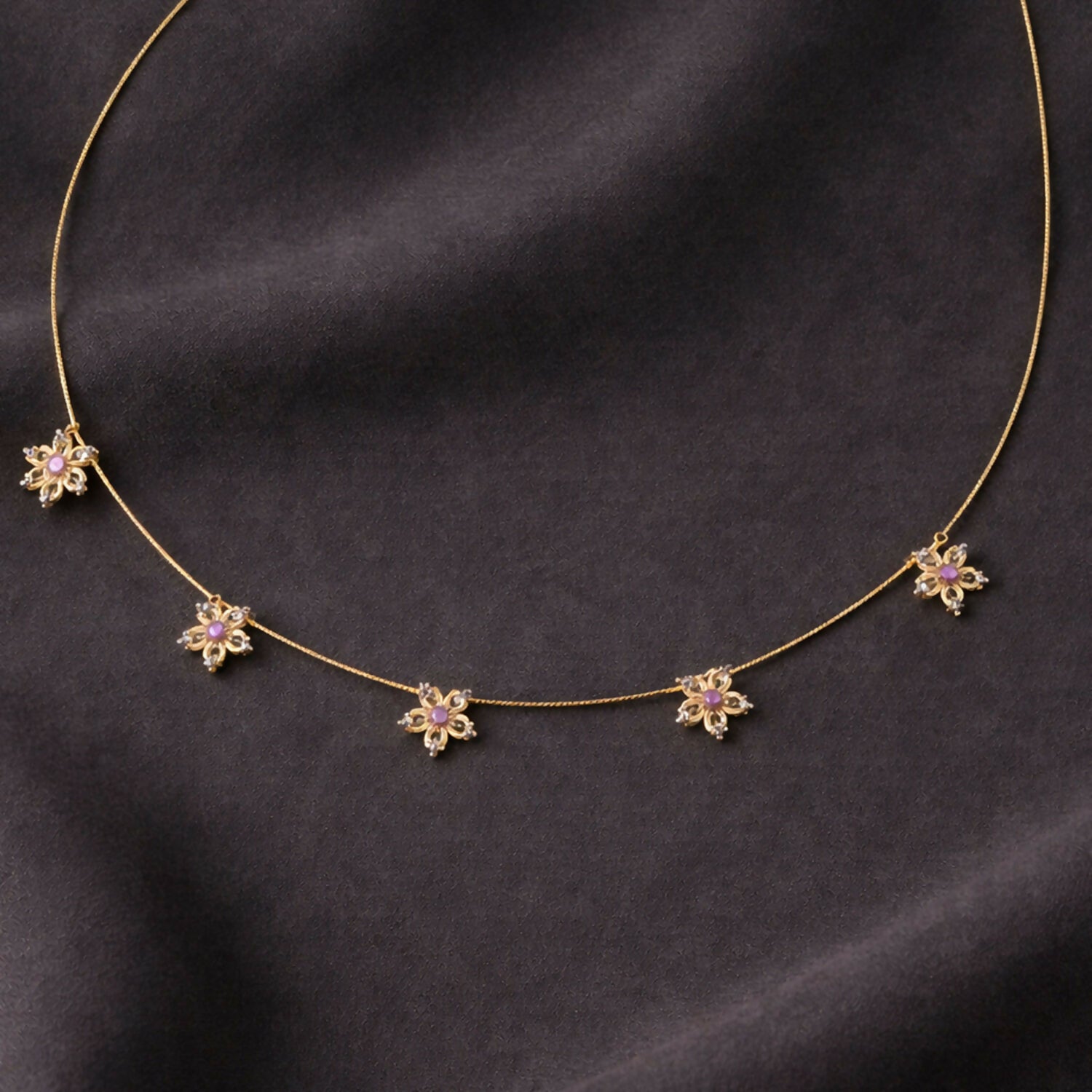 Elegant minimalist gold necklace with sparkling white stones