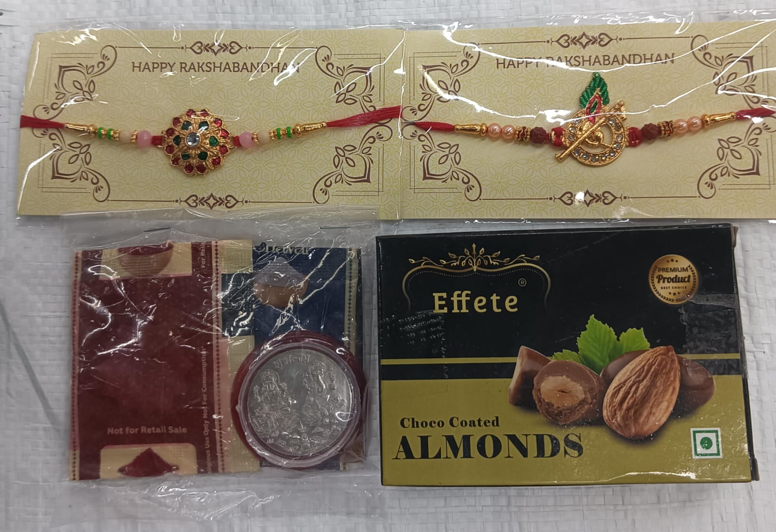 Combo Pack of 2 Designer Rakhi (Floral & Krishna Flute Design) with Choco Coated Almonds, Silver Coin, Roli Chawal & Raksha Bandhan Greeting Card