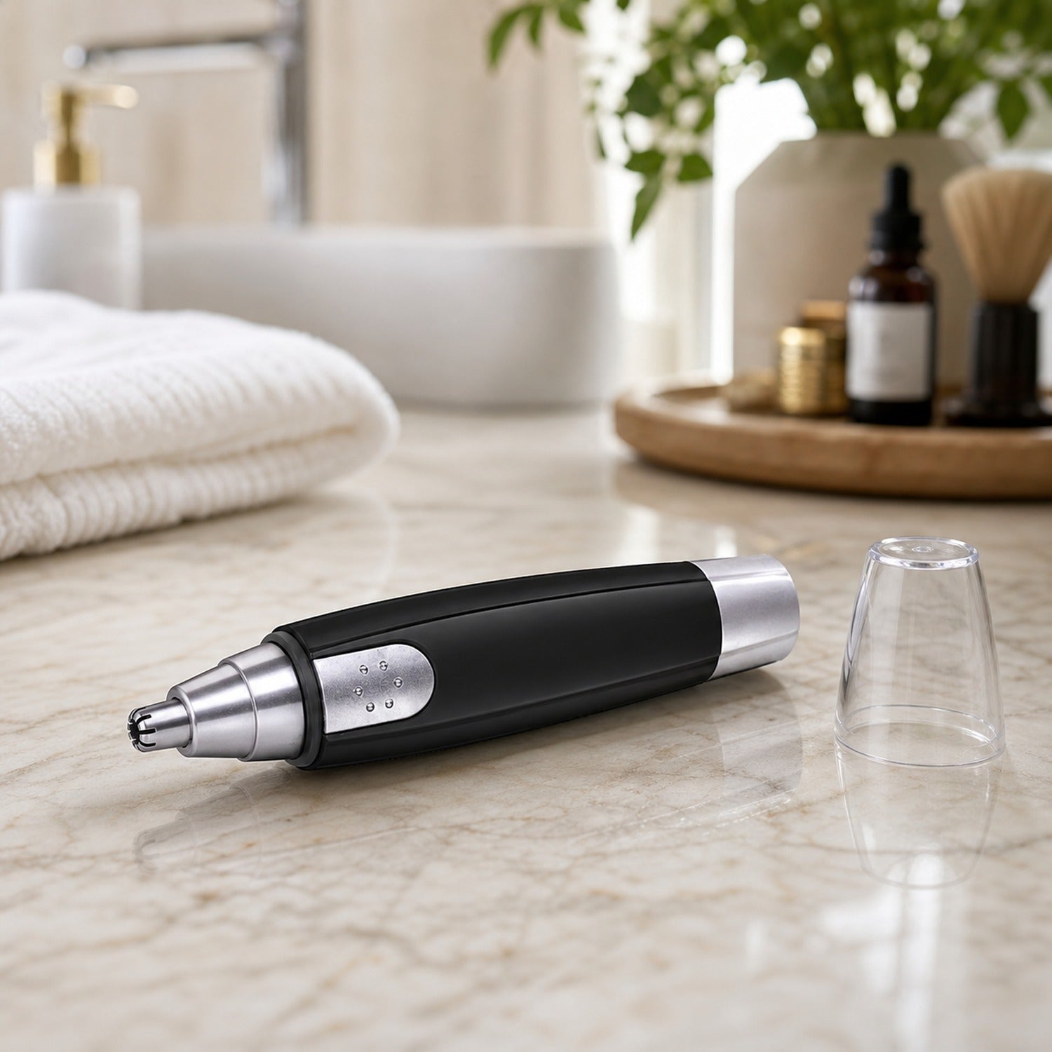 Top view of battery-operated nose hair trimmer