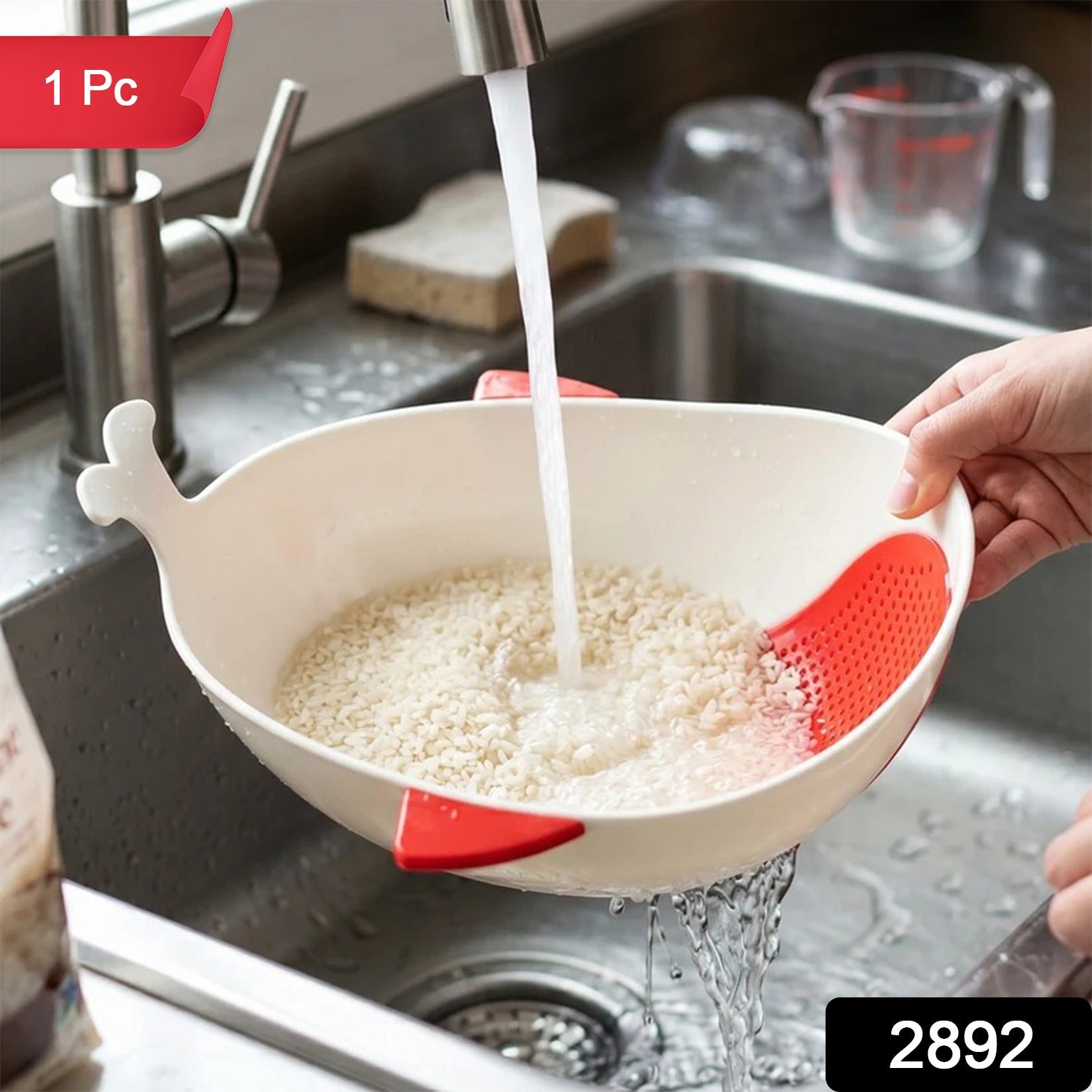 A person rinsing rice in a white whale-shaped bowl with red accents under a kitchen faucet, with a red "1 Pc" label and