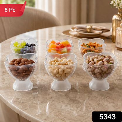 Six clear plastic dessert bowls filled with snacks and fruits on a marble table, with a red 6 Pc label.