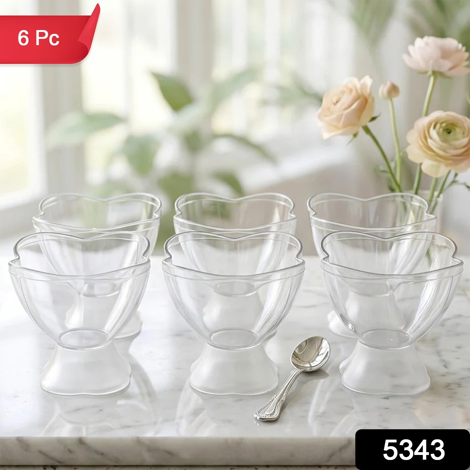 Six clear plastic ice cream bowls with a silver spoon on marble, with '6 Pc' and '5343' labels.