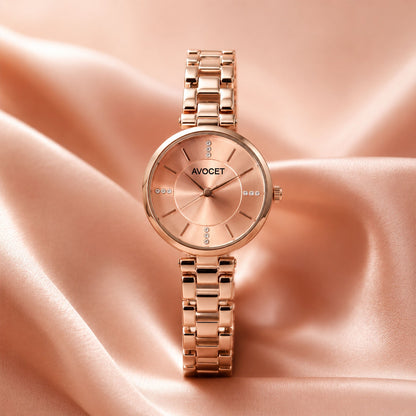 Women’s rose gold bracelet watch with peach dial and stone details on strap