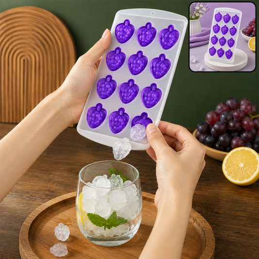 Hands removing a clear fruit-shaped ice cube from a purple silicone tray into a glass with ice and lemon.