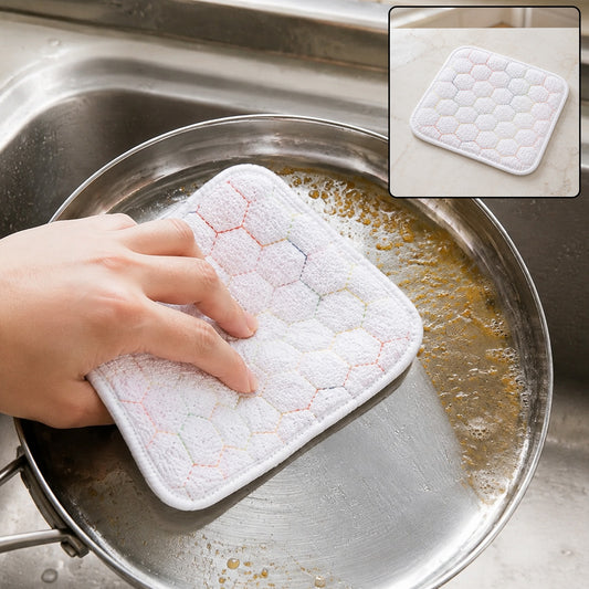 Hand scrubbing a dirty pan with a white honeycomb-patterned cleaning cloth, with an inset showing the cloth on a counter.