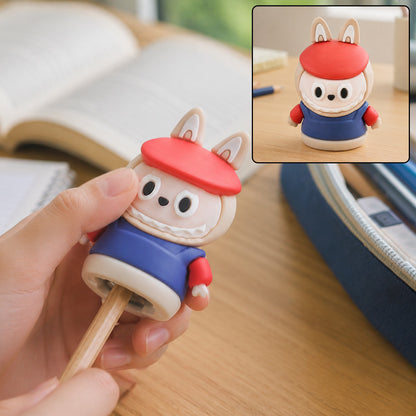 A hand holds a cartoon rabbit pencil sharpener, sharpening a pencil, with an inset showing the sharpener upright.