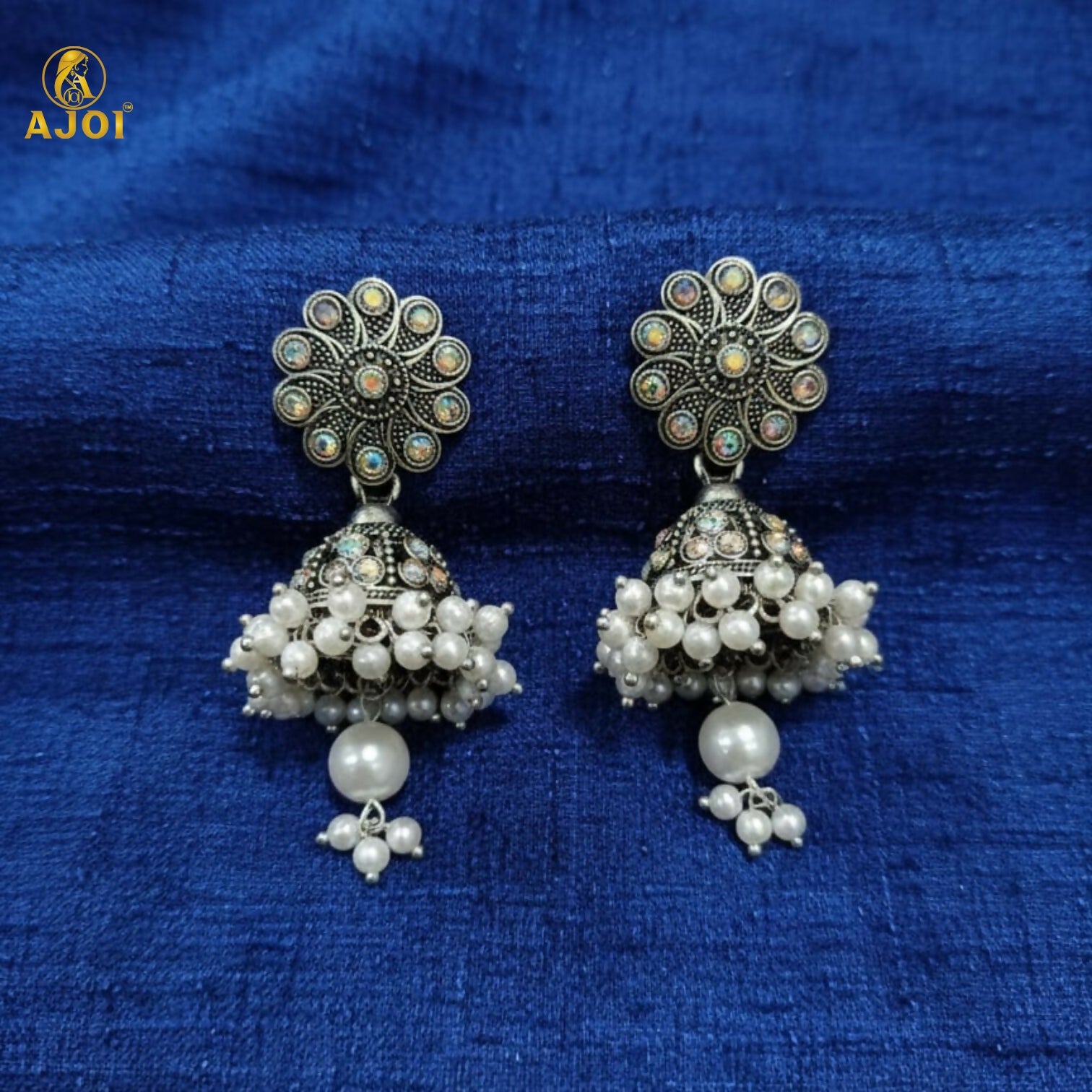 Close-up of pearl drops on oxidised silver jhumka earrings