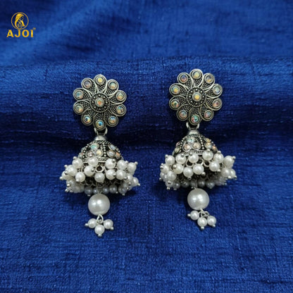 Close-up of pearl drops on oxidised silver jhumka earrings