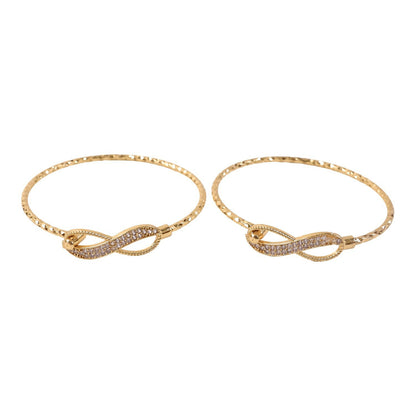 Gold infinity bracelet pair styled with traditional outfit