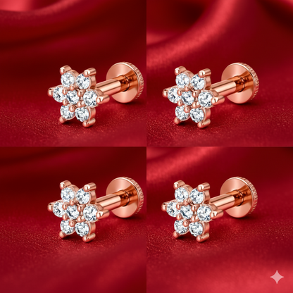 Close-up of rose gold plated flower stud earrings featuring sparkling zirconia stones and flat-back design