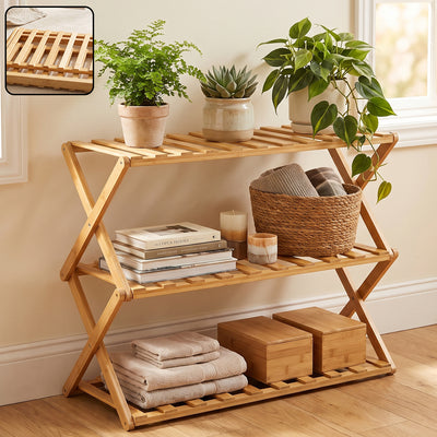 A light brown bamboo 3-tier shelf with slatted shelves, holding plants, books, and towels. Inset shows a close-up of the
