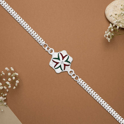 Close-up of silver chain detail on elegant flower rakhi