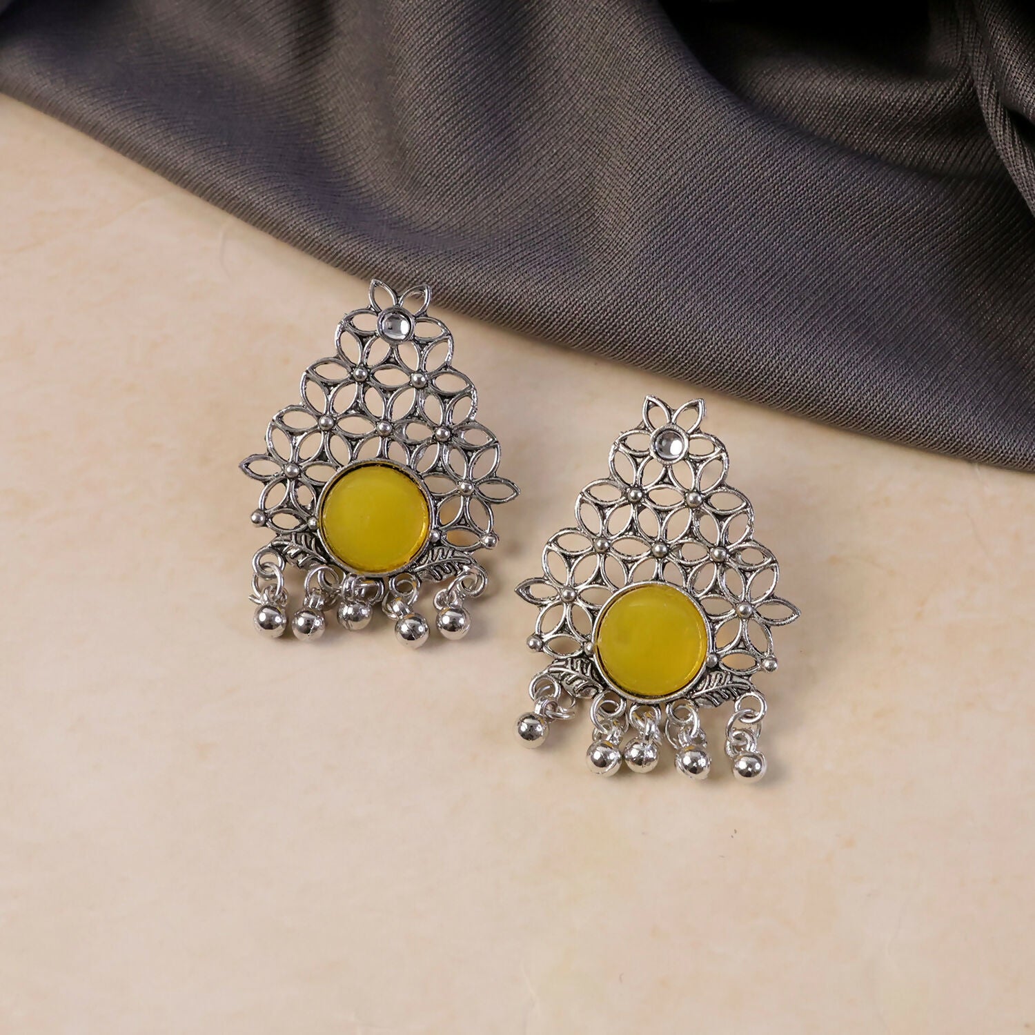 Back detail of oxidized silver earrings with ghungroo dangles