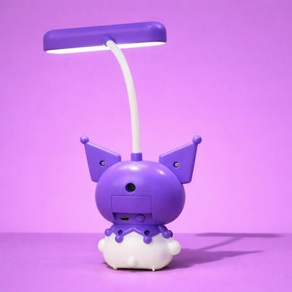 LED desk lamp with cute cartoon character base illuminated on study desk