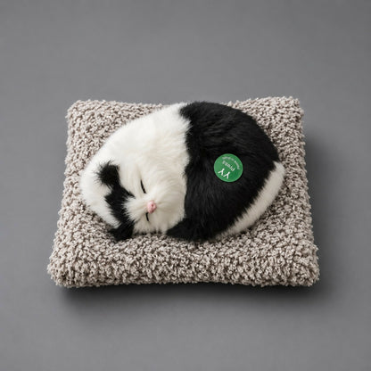 Close-up of soft fur on sleeping cat plush toy