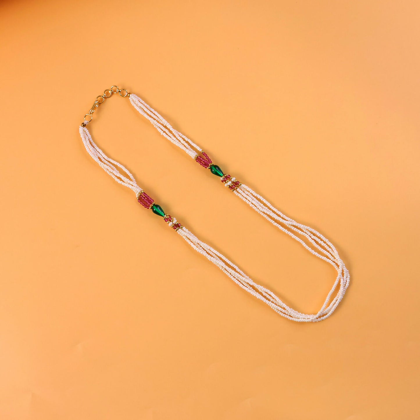 Close-up of pearl beads and colorful accents