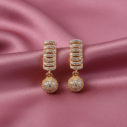 CZ studded designer drop earrings showing stacked stone pattern and hanging ball design