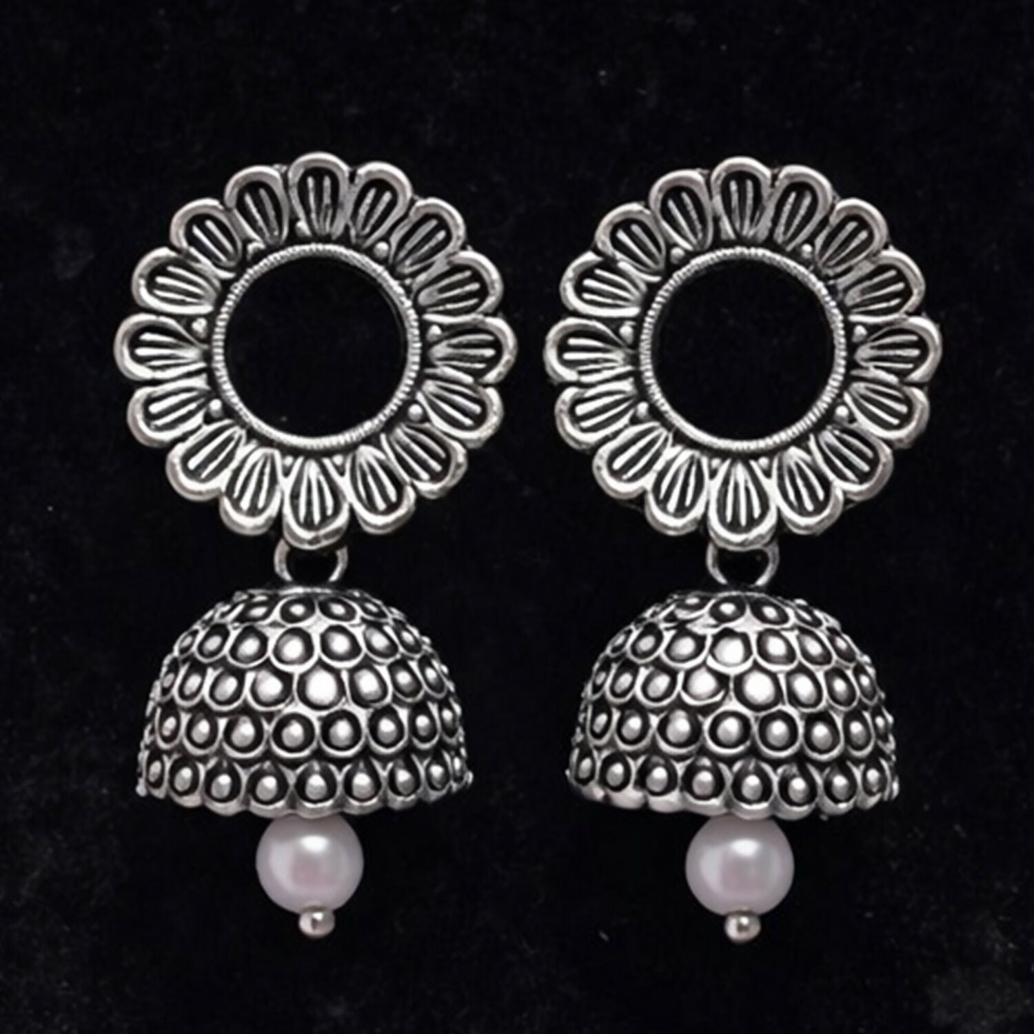Oxidized silver jhumka earrings styled with ethnic outfit for festive occasions